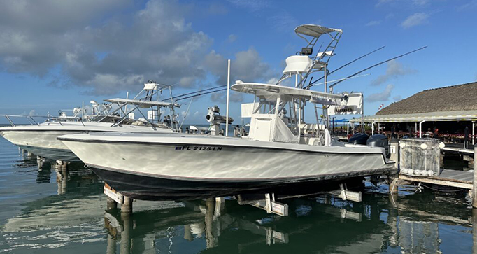 31′ Center Console fishing boat docked in the Florida Keys, designed for 1-6 anglers, ideal for reef, wreck, or offshore fishing trips.